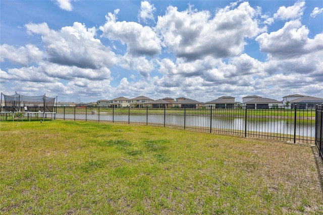 12710 Hysmith Loop, Parrish, FL 34219 - view of yard with a trampoline, a residential view, and a water view