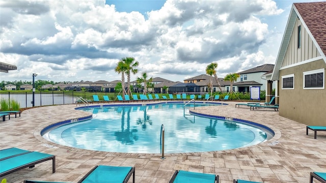 12710 Hysmith Loop, Parrish, FL 34219 - community pool featuring fence, a residential view, and a patio area