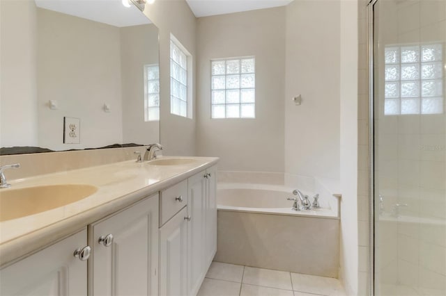 1330 Mariposa Cir Unit 104, Naples, FL 34105 - full bath with a garden tub, a shower stall, double vanity, and tile patterned flooring