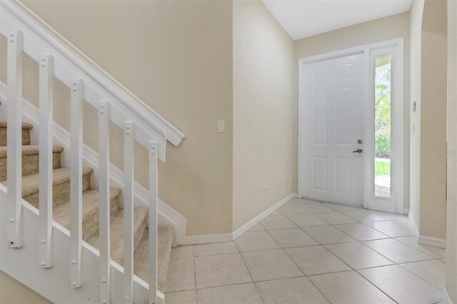 1330 Mariposa Cir Unit 104, Naples, FL 34105 - foyer entrance featuring light tile patterned floors and stairs