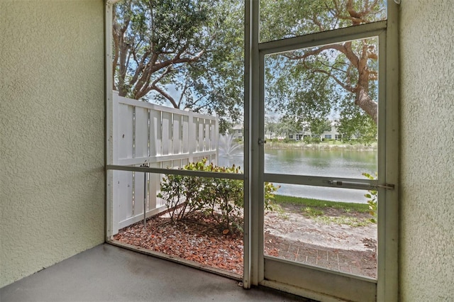 1330 Mariposa Cir Unit 104, Naples, FL 34105 - unfurnished sunroom featuring a water view