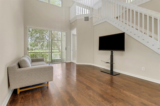 1330 Mariposa Cir Unit 104, Naples, FL 34105 - living room with wood finished floors and a high ceiling