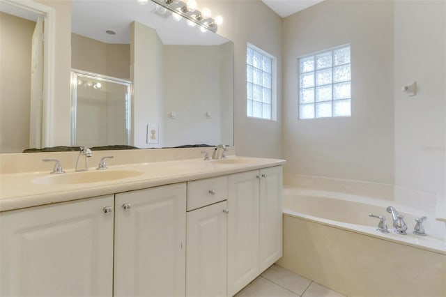 1330 Mariposa Cir Unit 104, Naples, FL 34105 - full bathroom with a stall shower, a bath, double vanity, and tile patterned floors