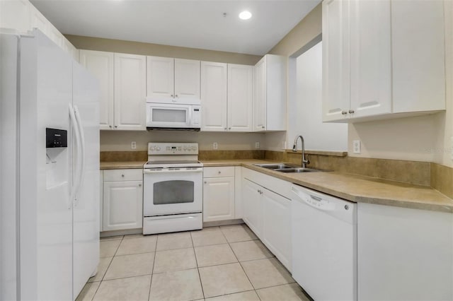 1330 Mariposa Cir Unit 104, Naples, FL 34105 - kitchen featuring white appliances, white cabinetry, light tile patterned flooring, recessed lighting, and light countertops