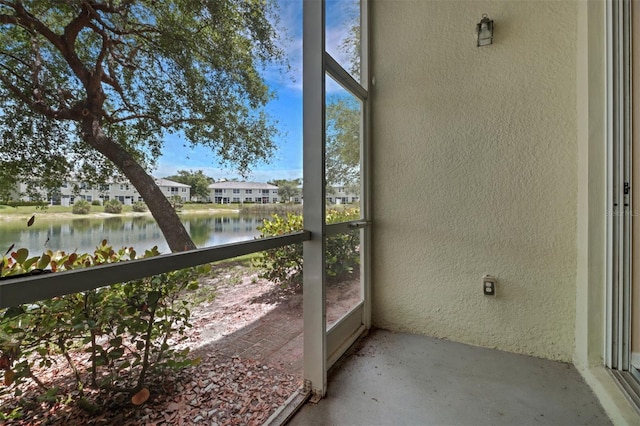 1330 Mariposa Cir Unit 104, Naples, FL 34105 - unfurnished sunroom with a water view