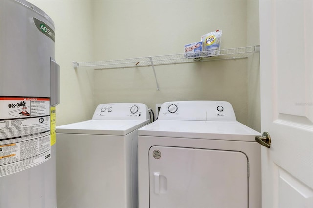 1330 Mariposa Cir Unit 104, Naples, FL 34105 - washroom featuring water heater and washer and clothes dryer