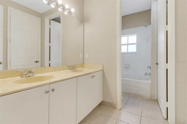 1330 Mariposa Cir Unit 104, Naples, FL 34105 - bathroom featuring double vanity, tile patterned flooring, and shower / washtub combination