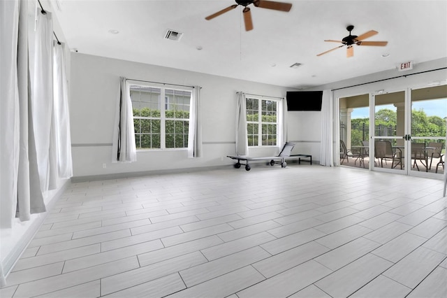 1330 Mariposa Cir Unit 104, Naples, FL 34105 - unfurnished room with a ceiling fan and baseboards