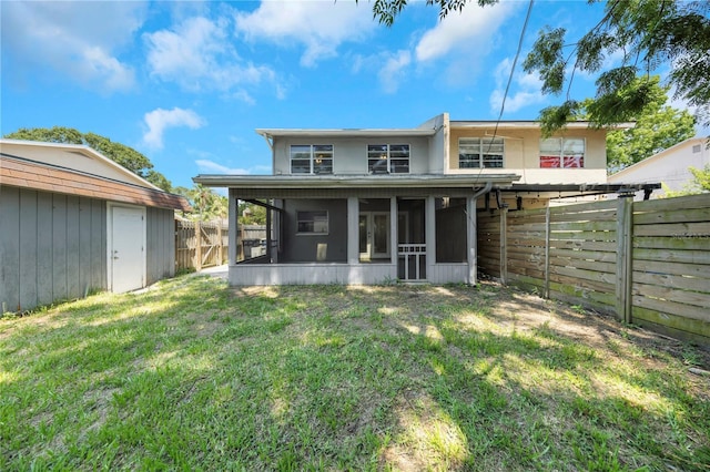 2048 Los Lomas Dr, Clearwater, FL 33763 - rear view of house with a sunroom and an outbuilding