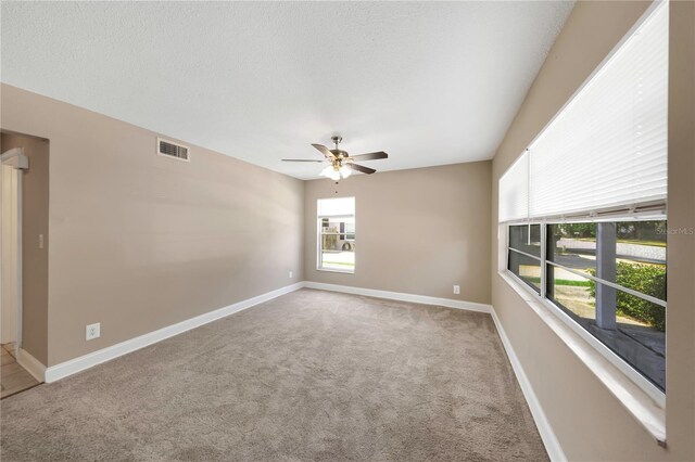 2048 Los Lomas Dr, Clearwater, FL 33763 - empty room with a ceiling fan, carpet, and baseboards