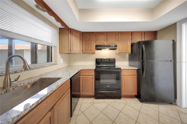 2048 Los Lomas Dr, Clearwater, FL 33763 - kitchen featuring black appliances, under cabinet range hood, a sink, a tray ceiling, and light stone countertops