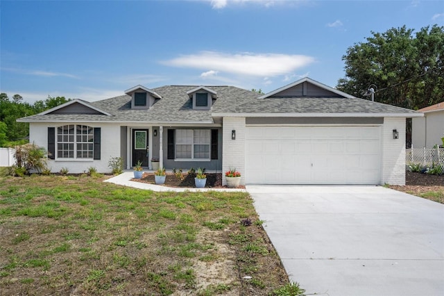 view of front of house featuring brick siding, a garage, a shingled roof, and concrete driveway