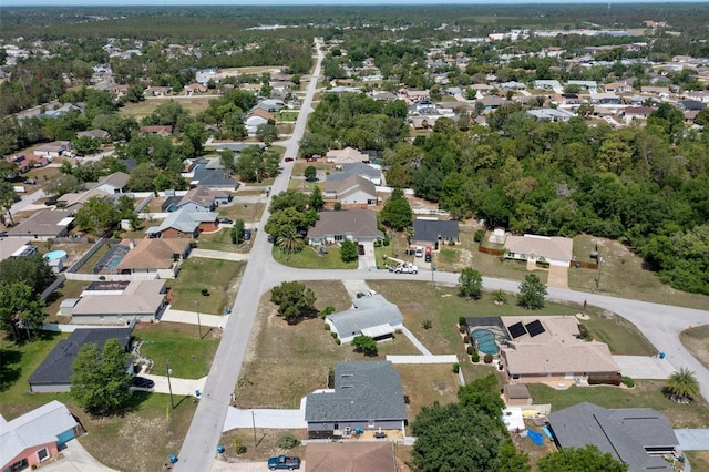 aerial view of property's location with nearby suburban area