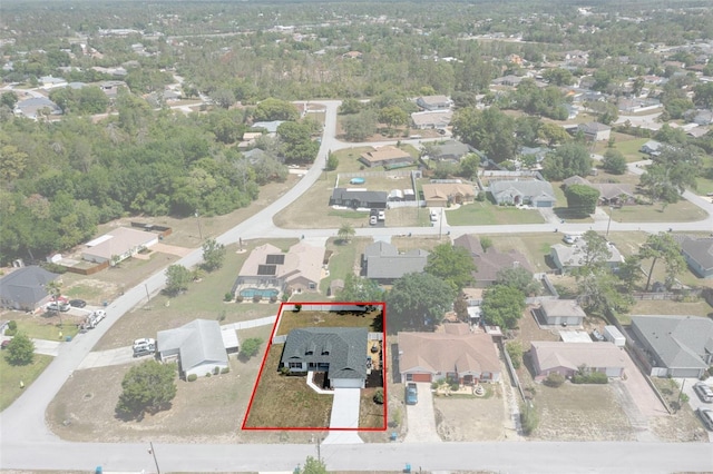 aerial view of residential area with property parcel outlined