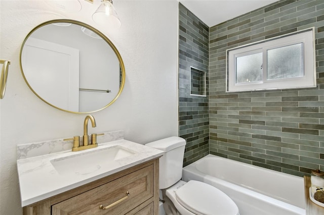 bathroom with toilet, vanity, and tub / shower combination