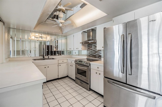 kitchen featuring appliances with stainless steel finishes, wall chimney range hood, a sink, light countertops, and light tile patterned floors