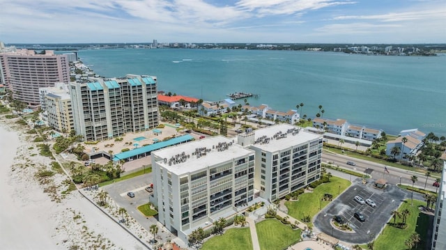 view of urban area with a large body of water and apartment complex / building