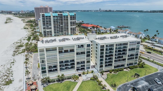 view of urban area featuring a nearby body of water and apartment complex / building