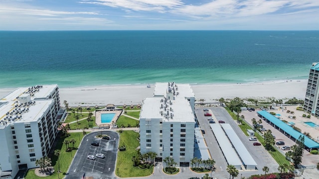 drone / aerial view of unending shoreline and apartment complex