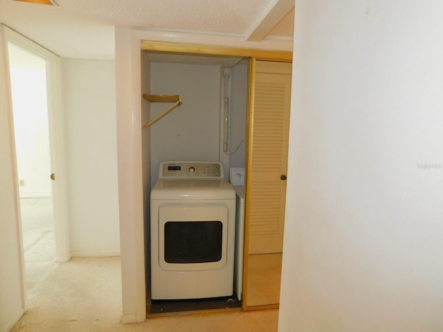 1400 Gulf Blvd Unit 306, Clearwater Beach, FL 33767 - washroom featuring washer / dryer and carpet