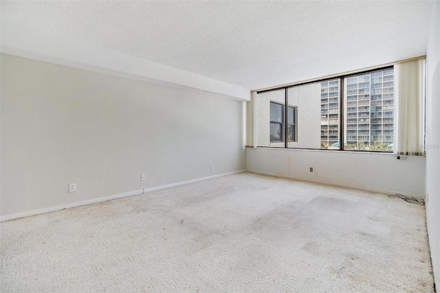 1400 Gulf Blvd Unit 306, Clearwater Beach, FL 33767 - empty room featuring carpet floors and a textured ceiling