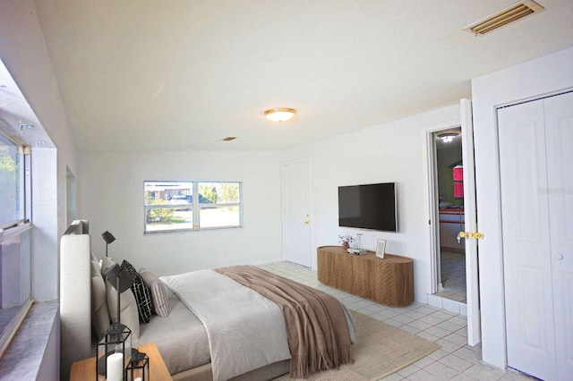 1111 Briarwood Rd, Brandon, FL 33511 - bedroom with light tile patterned floors and a closet