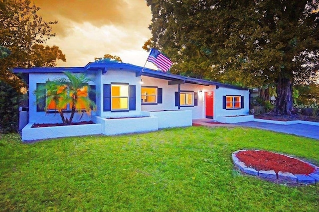 1111 Briarwood Rd, Brandon, FL 33511 - view of front of home with a front lawn and stucco siding
