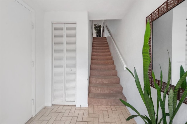 745 Pinellas Bayway S Unit 206, Saint Petersburg, FL 33715 - stairway with brick patterned floors and baseboards