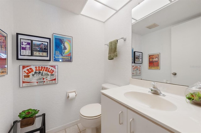 745 Pinellas Bayway S Unit 206, Saint Petersburg, FL 33715 - half bathroom with toilet, vanity, and tile patterned floors