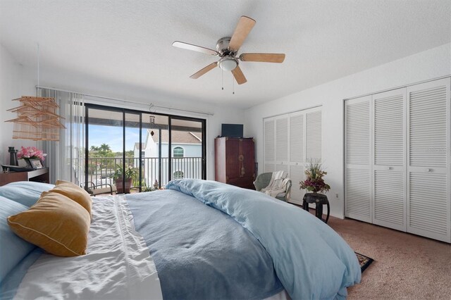 745 Pinellas Bayway S Unit 206, Saint Petersburg, FL 33715 - bedroom with access to exterior, multiple closets, carpet, and ceiling fan