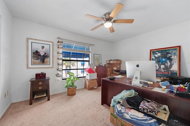 745 Pinellas Bayway S Unit 206, Saint Petersburg, FL 33715 - carpeted home office with a ceiling fan and baseboards