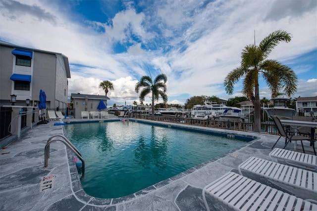 745 Pinellas Bayway S Unit 206, Saint Petersburg, FL 33715 - community pool with fence and a patio