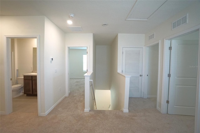 10928 Carlton Fields Dr, Riverview, FL 33579 - corridor with an upstairs landing, visible vents, and light colored carpet