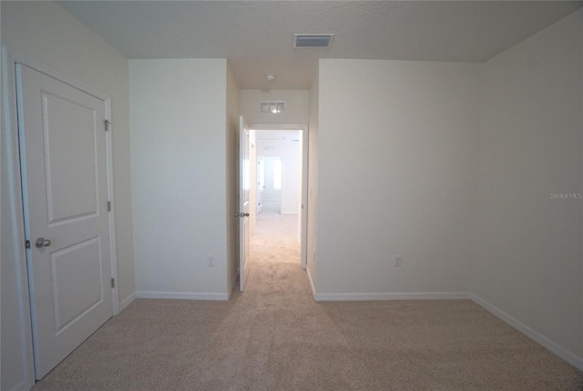 10928 Carlton Fields Dr, Riverview, FL 33579 - spare room with light carpet, baseboards, and visible vents