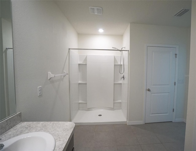 10928 Carlton Fields Dr, Riverview, FL 33579 - bathroom featuring a stall shower, tile patterned flooring, and visible vents