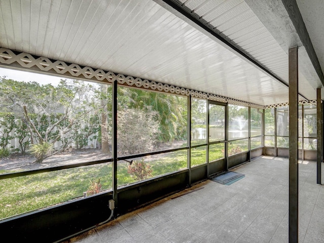 unfurnished sunroom featuring plenty of natural light