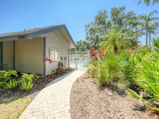 view of home's exterior with fence