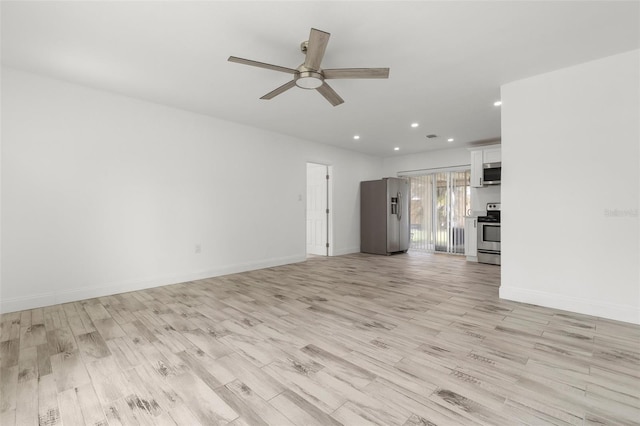 unfurnished living room featuring recessed lighting, a ceiling fan, light wood-type flooring, and baseboards