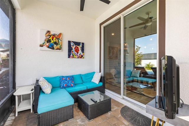 sunroom / solarium with ceiling fan and outdoor lounge area