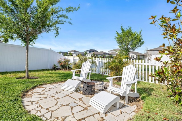 view of yard featuring a residential view and a patio area