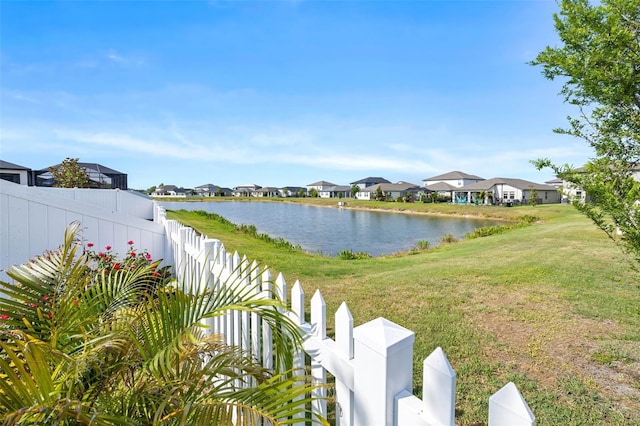 water view featuring nearby suburban area and fence