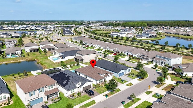 view of property location with nearby suburban area and a large body of water