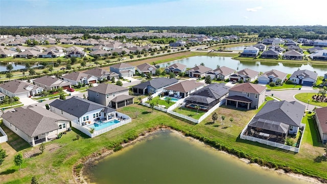 aerial view of residential area with a large body of water