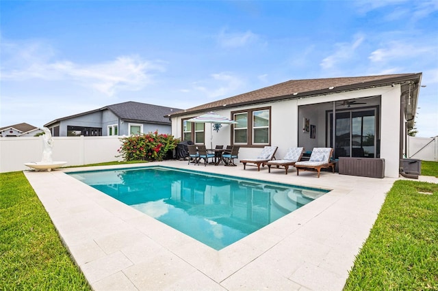 view of pool with a patio area and ceiling fan