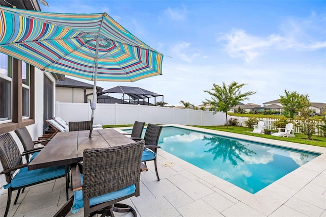 view of swimming pool featuring a fenced backyard, a patio area, and outdoor dining space