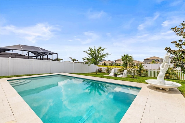view of pool with a fenced backyard and a patio
