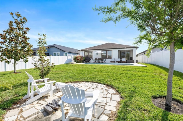 rear view of property featuring a patio area