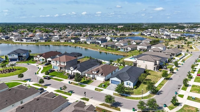 view of property location with nearby suburban area and a nearby body of water
