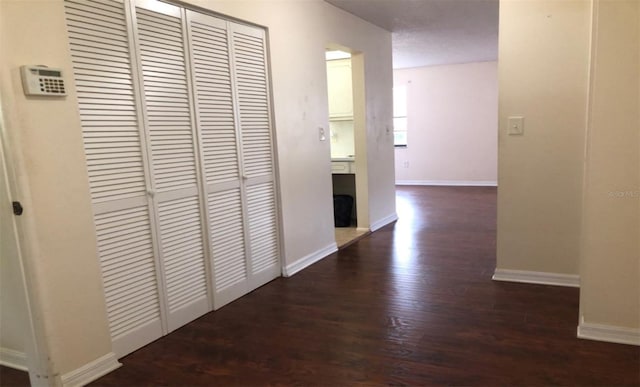 5967 Terrace Park Dr N Unit 101, Saint Petersburg, FL 33709 - corridor with wood finished floors and baseboards