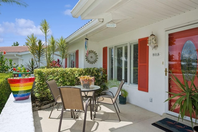 9018 39th Ln N Unit 5, Pinellas Park, FL 33782 - view of patio with outdoor dining area